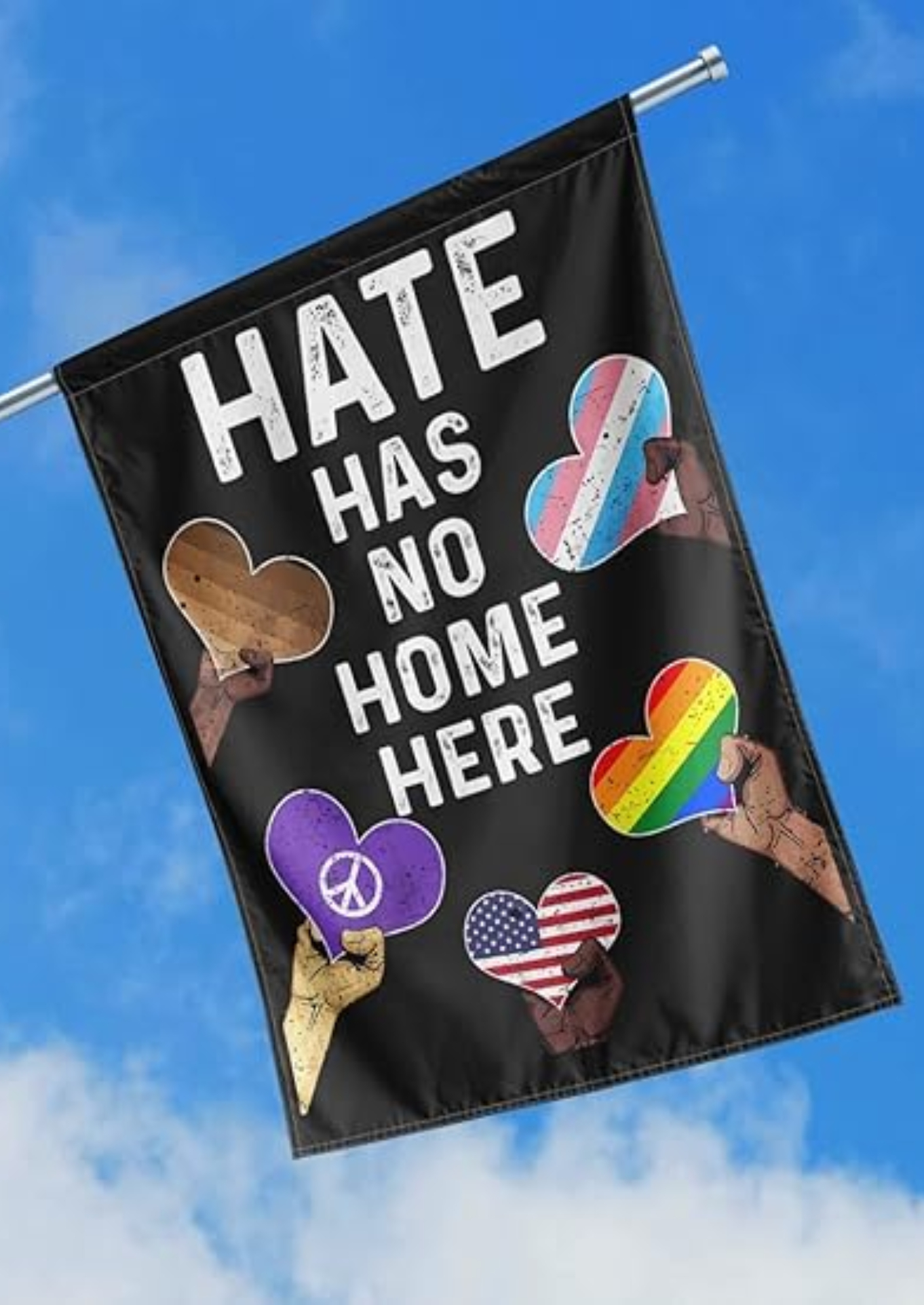 Beautiful sky with beautiful Hate Has No Home Here garden flag